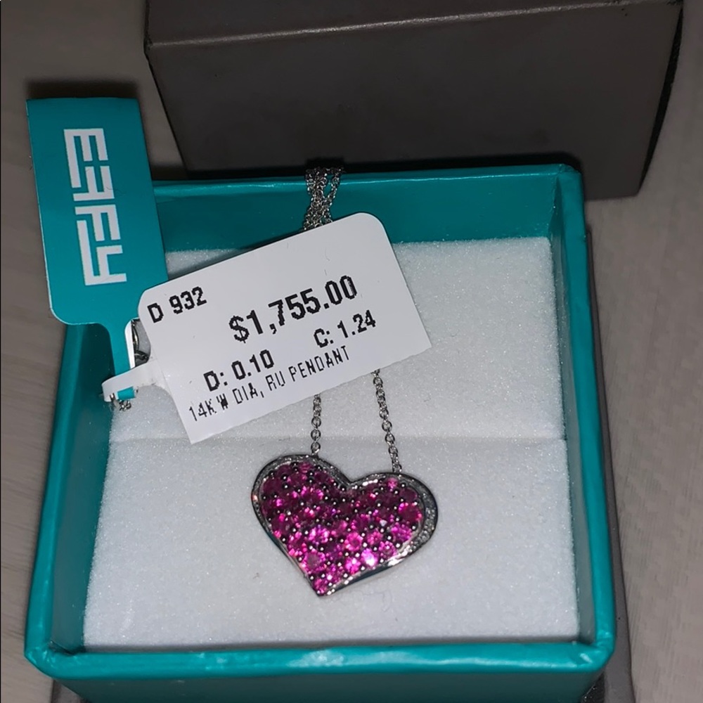 14 karat white gold diamond and ruby heart Pendant